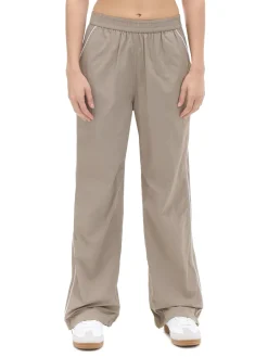 Sale Beżowe spodnie jogger Spodnie