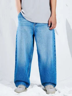 Sale e jeansy skater z efektem sprania Jeansy